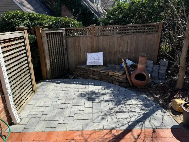 Natural stone patio under a covered porch