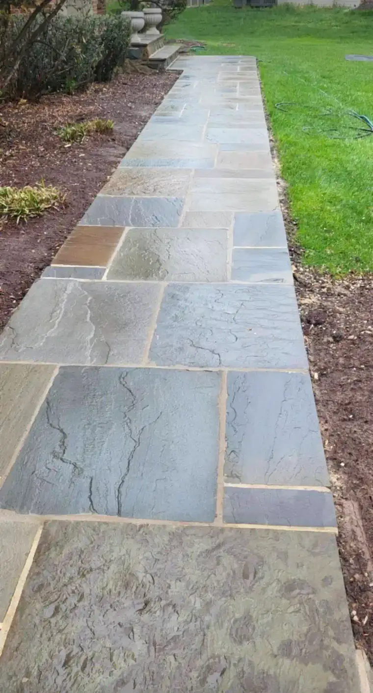 Residential outdoor walkway made of natural stone veneer
