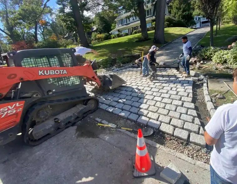Onyx Home Improvement contractors laying a new stone walkway
