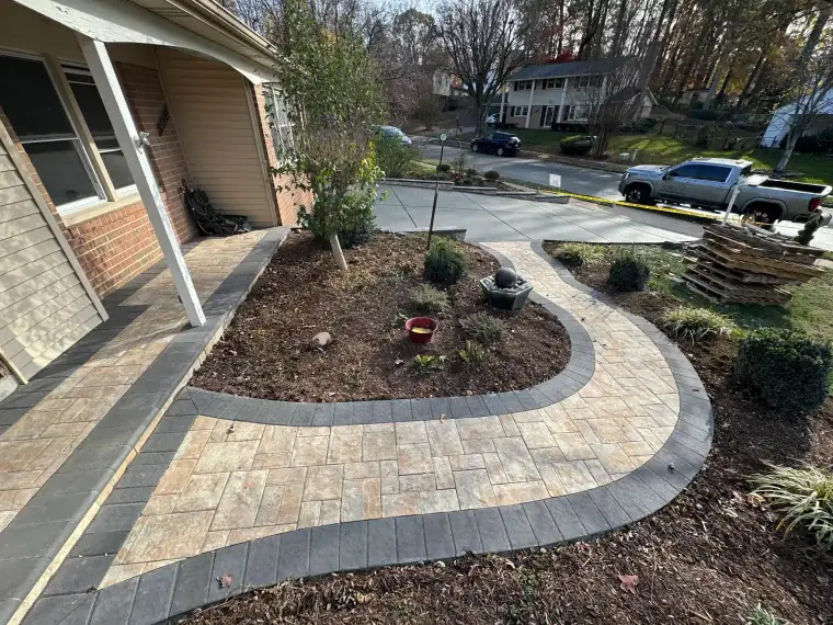 Natural stone walkway curving to a residential front door