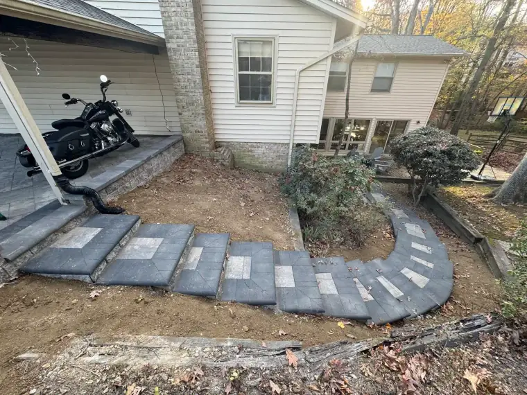 Natural stone steps and retaining wall leading to a front door