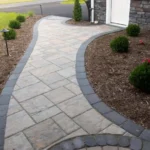 High-quality stone walkway, surrounded by mulch.