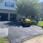 Newly paved residential asphalt driveway.