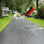 Newly paved residential asphalt driveway.