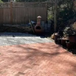 Patio flooring made out of bricks.