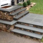 Stone work steps leading up to a home.