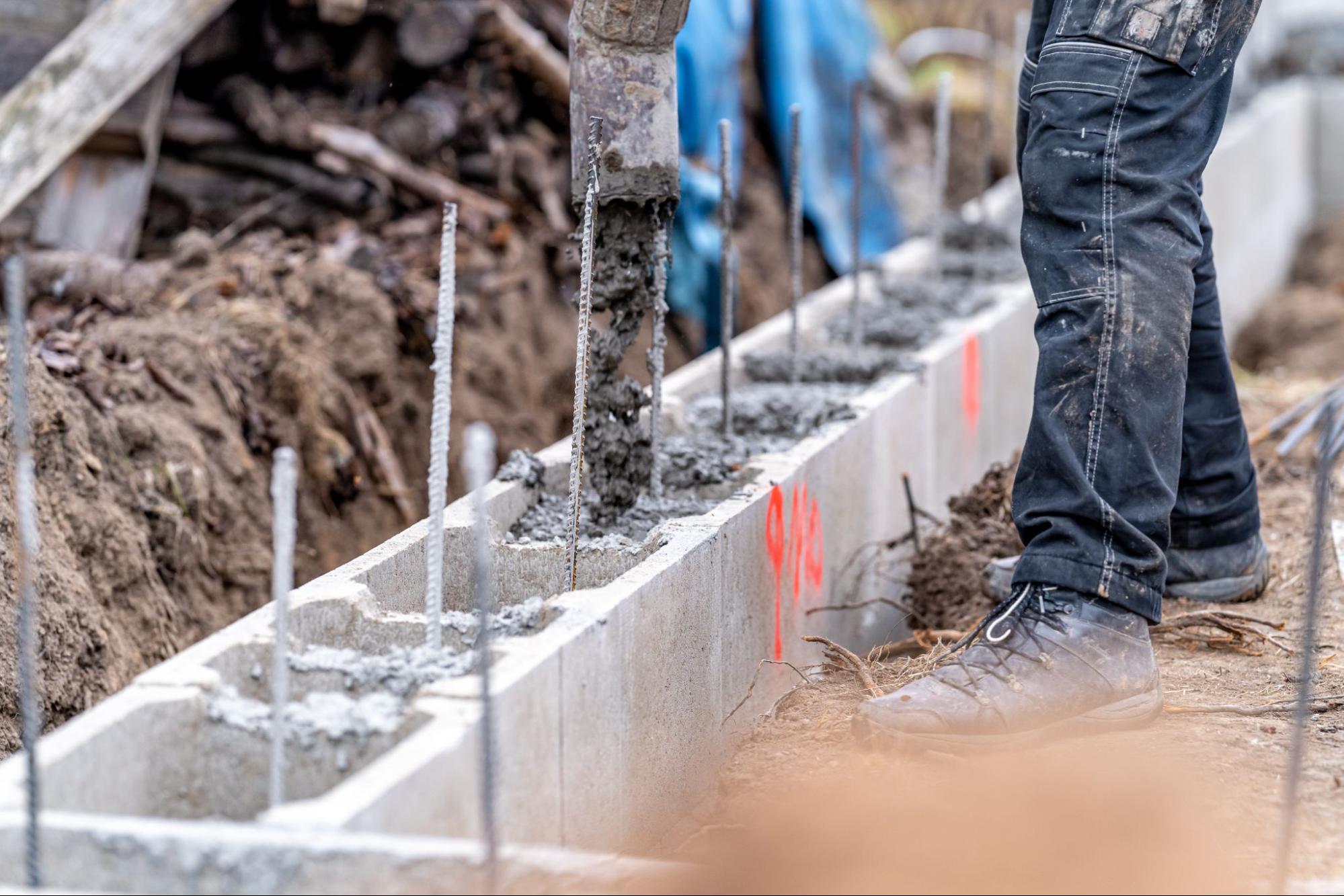 Concrete foundation work in progress for a new building under construction.