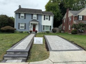 Newly paved concrete walkways with smooth exposed aggregate finish by a local paving company.