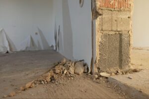 Interior view of a house undergoing professional foundation repair work.