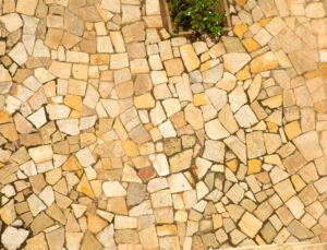Overhead view of a warm-toned stone patio.